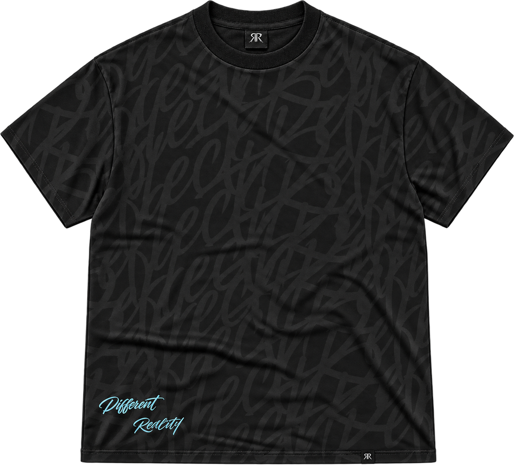 A black short-sleeve t-shirt with an all-over tonal script pattern and a light blue 'Different Reality' graphic near the bottom left, displayed on a clean white background.